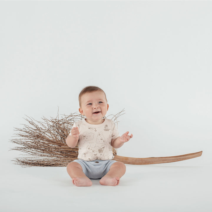 Childrens clothes on light background