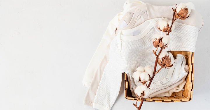 Cute newborn clothes. Organic cotton baby apparel mockup. Flat lay, top view