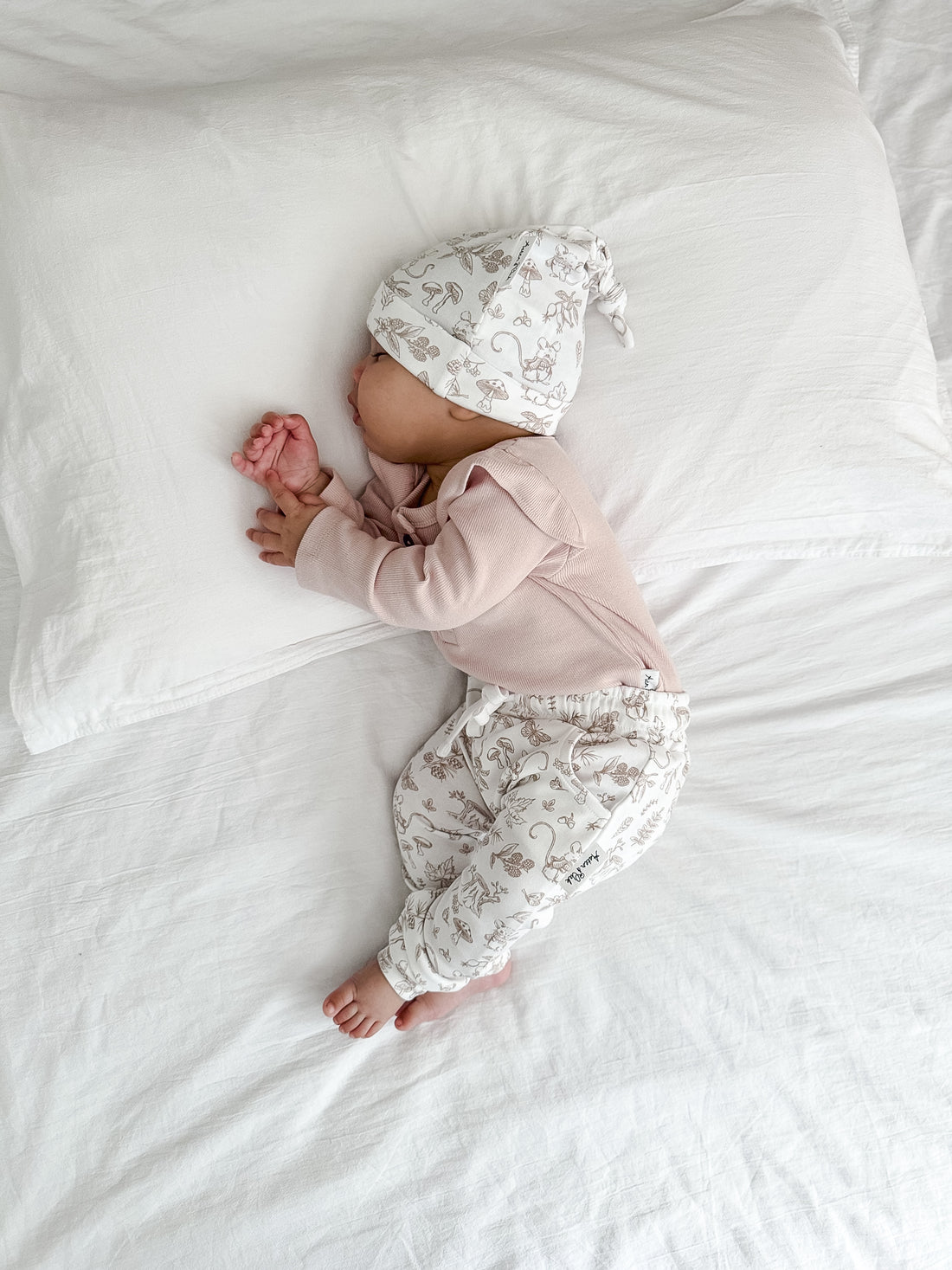 Pale Pink Rib Flutter Onesie